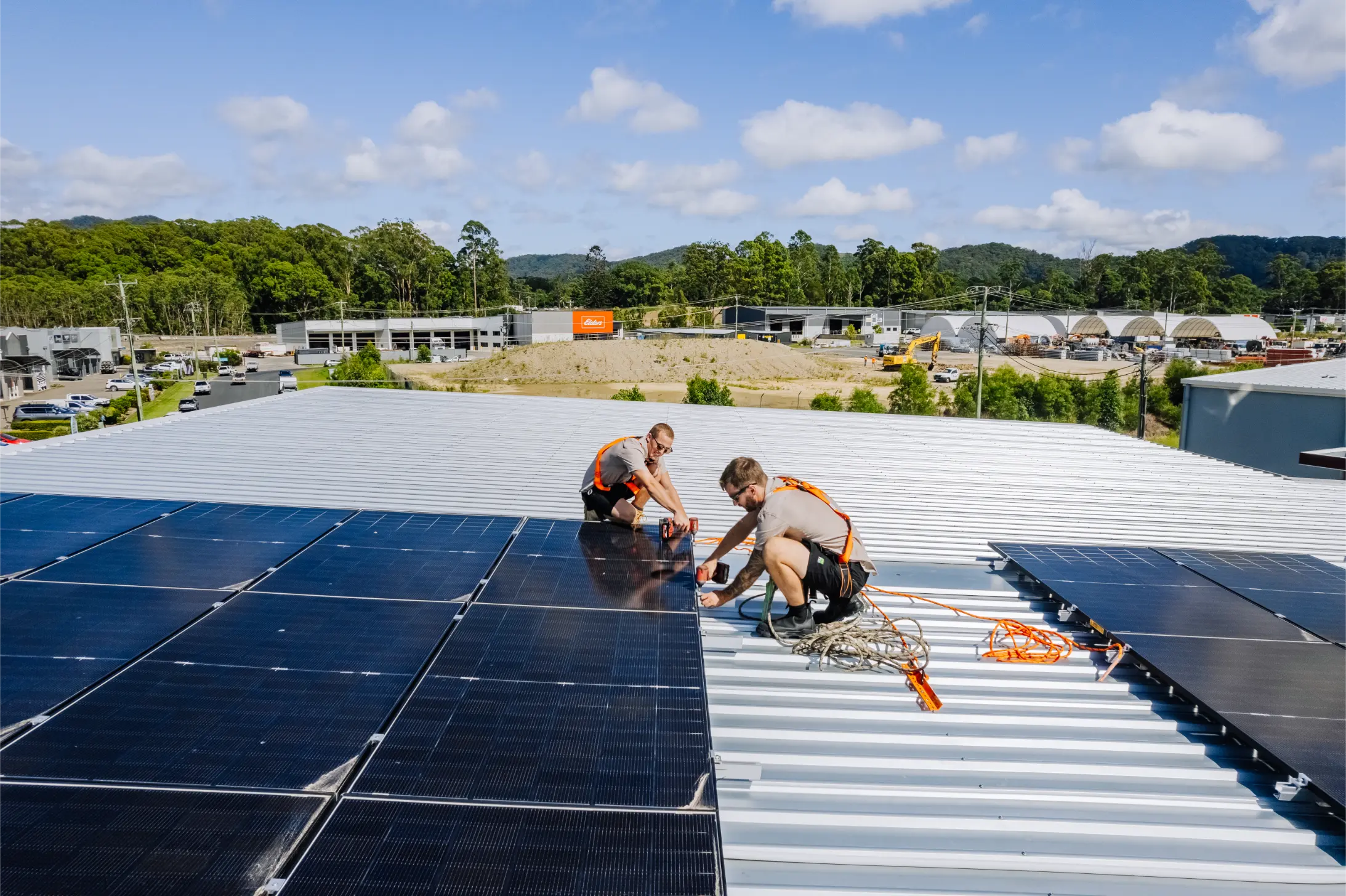 Gecko installers fitting solar panels on a Coffs Harbour rooftop