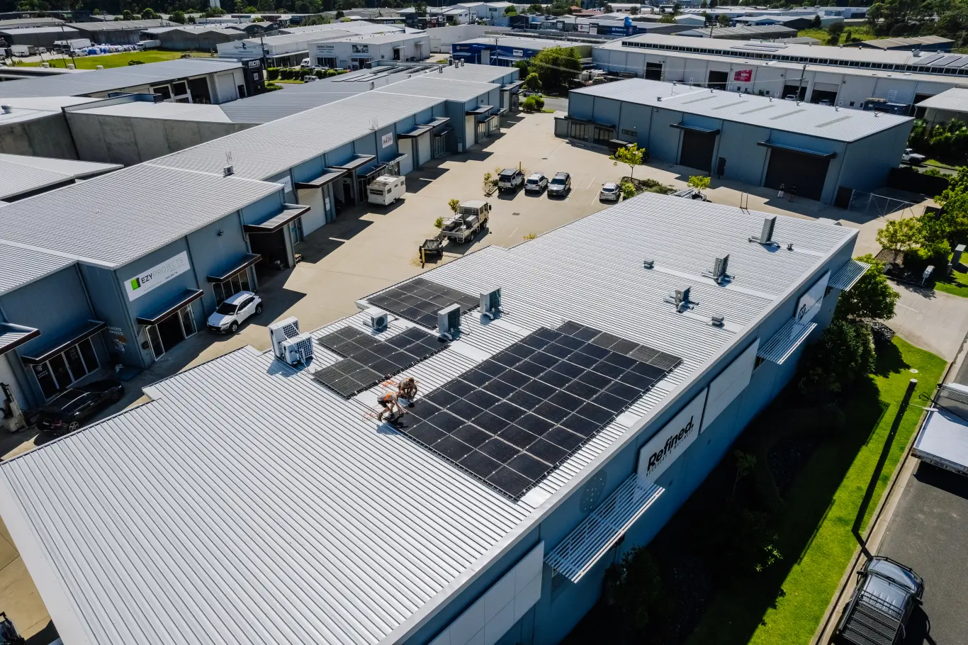 Aerial view of a Gecko commercial solar installation on a business roof in a Coffs Coast industrial estate